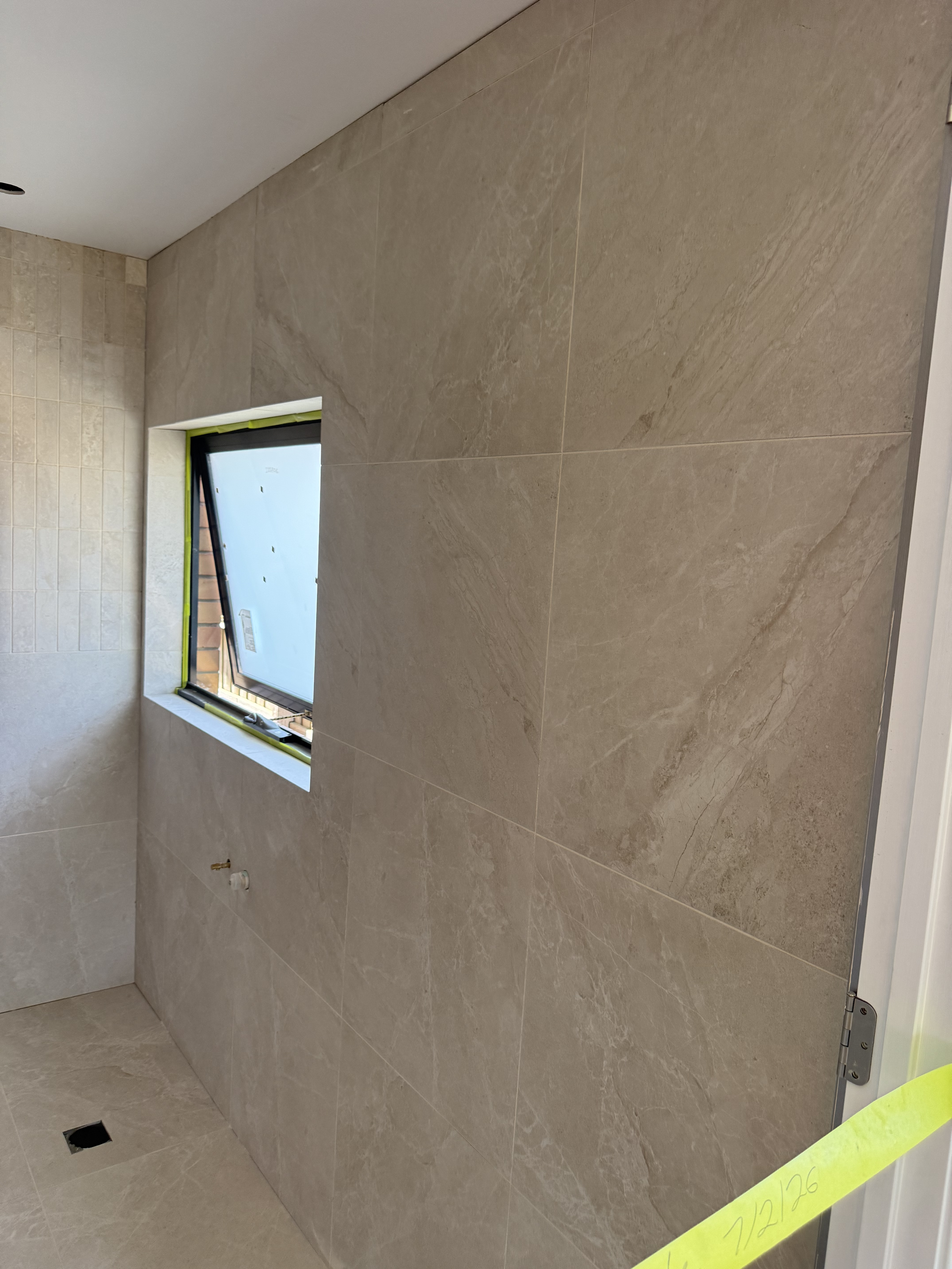 Luxury beige bathroom tiling project in Melbourne, Victoria - gallery photo