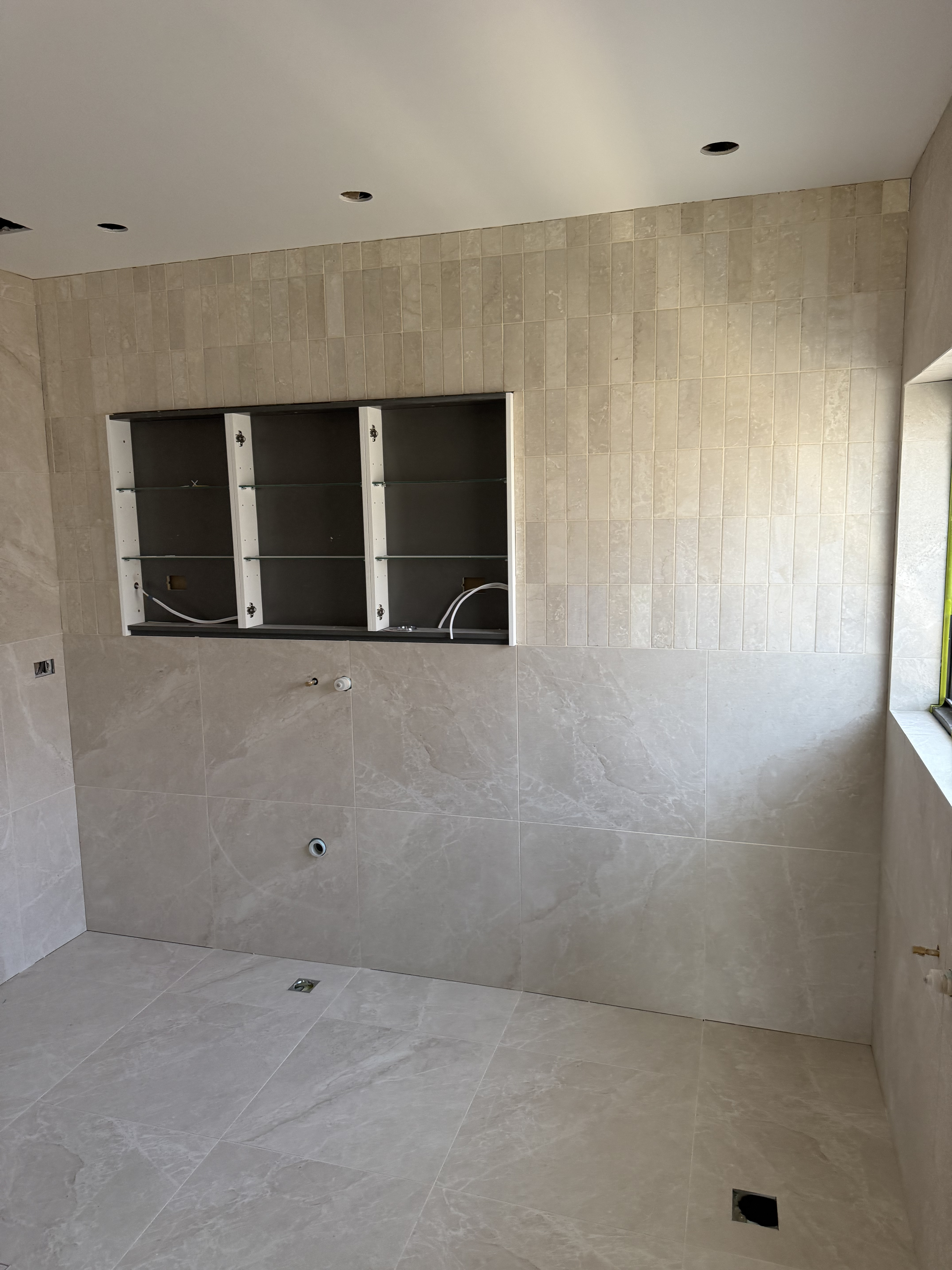 Luxury beige bathroom tiling project in Melbourne, Victoria