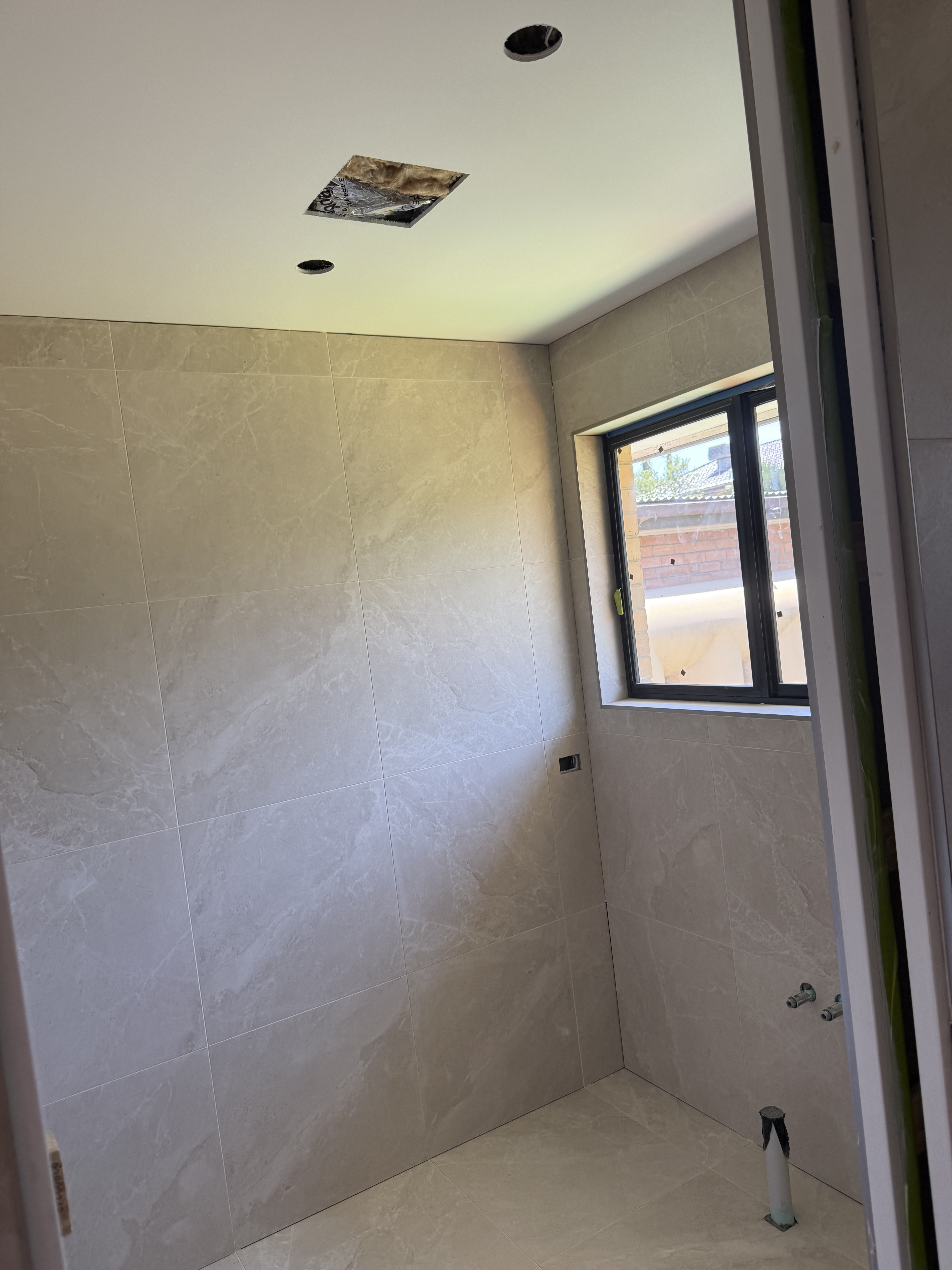 Luxury beige bathroom tiling project in Melbourne, Victoria - gallery photo